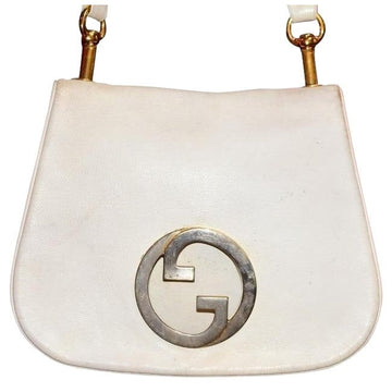 Vintage 1970s Gucci white textured leather Blondie style saddle bag with XL gold GG logo cutout in mint condition