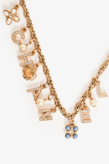 Chanel 2019 Gold Tone Faux Pearl 'CHANEL' Charm Necklace